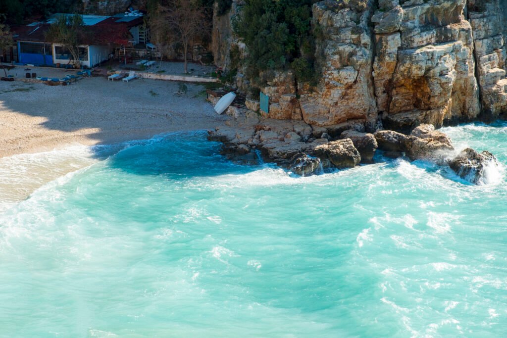 High angle view of turquoise Mediterranean Sea water at Mermaid Beach in Kas, Turkey. Horizontal